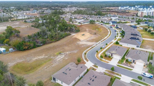 an aerial view of a swimming pool and lake view