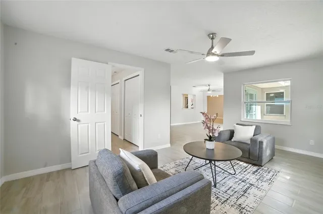 a living room with furniture and a window
