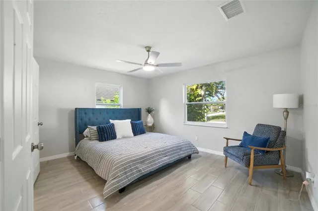 a bedroom with a bed and a table