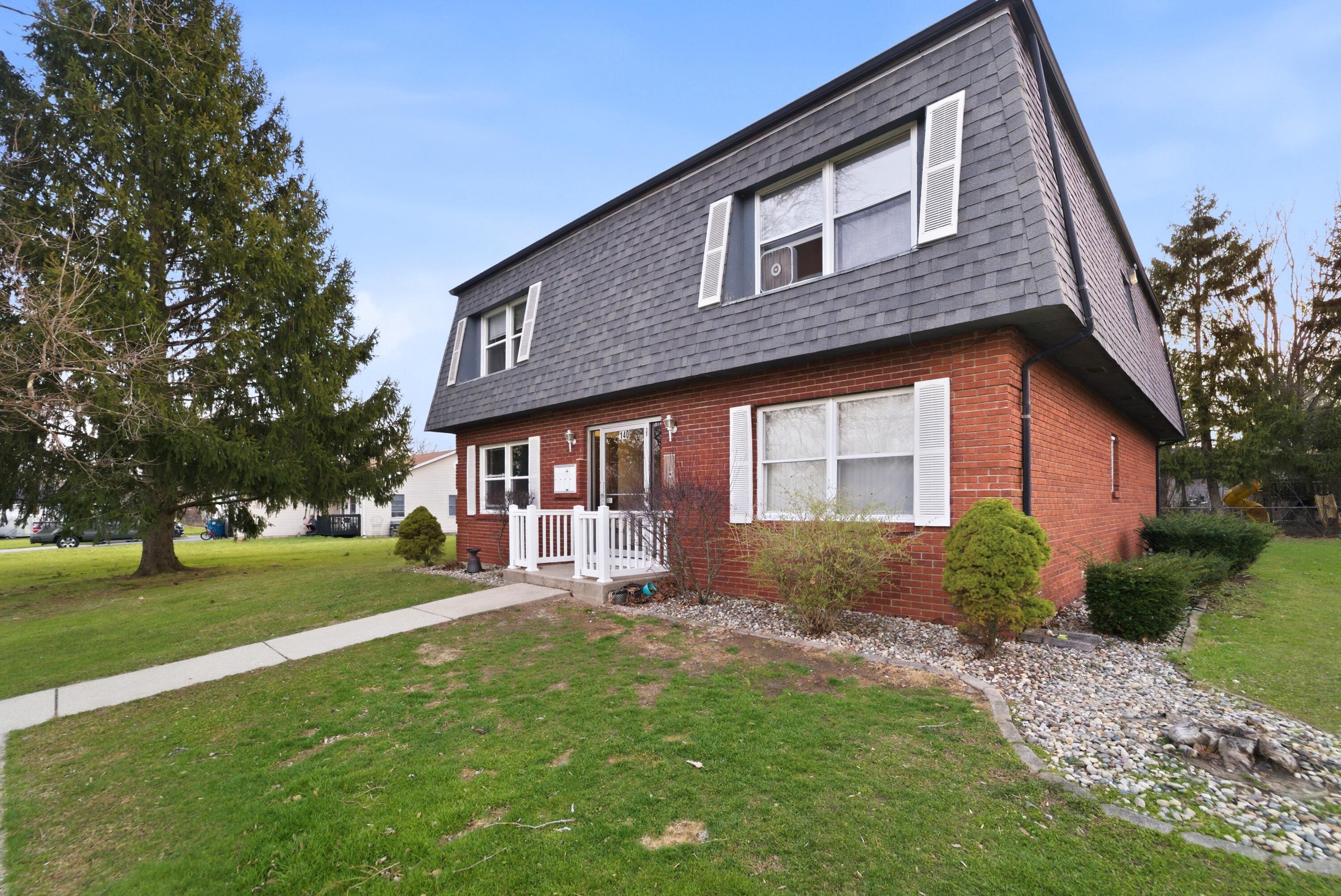 140 Sycamore Court, Unit 142 Hebron, IN 46341 - Photo 11 of 11 a front view of a house with garden