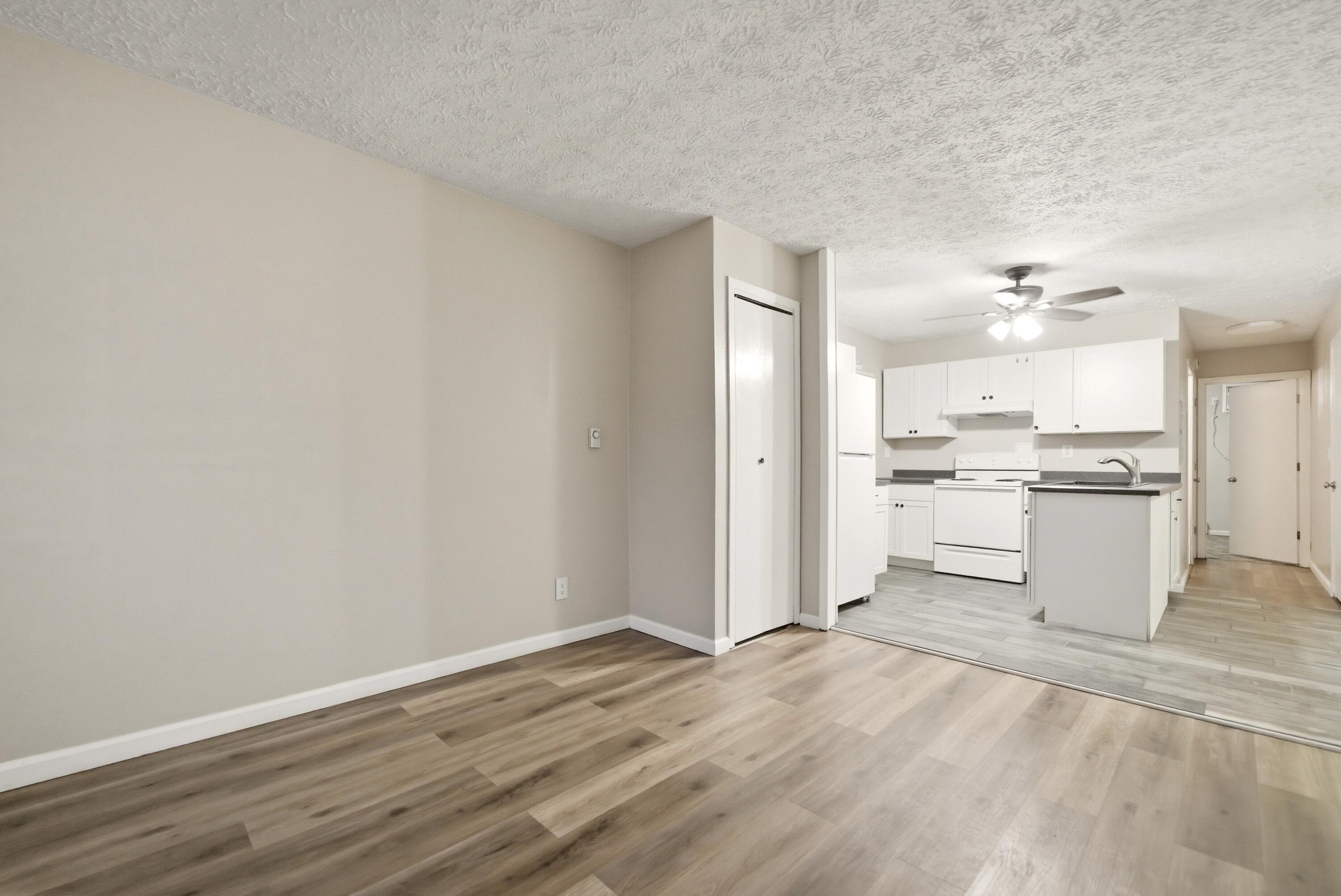 140 Sycamore Court, Unit 142 Hebron, IN 46341 - Photo 2 of 11 a view of kitchen with wooden floor