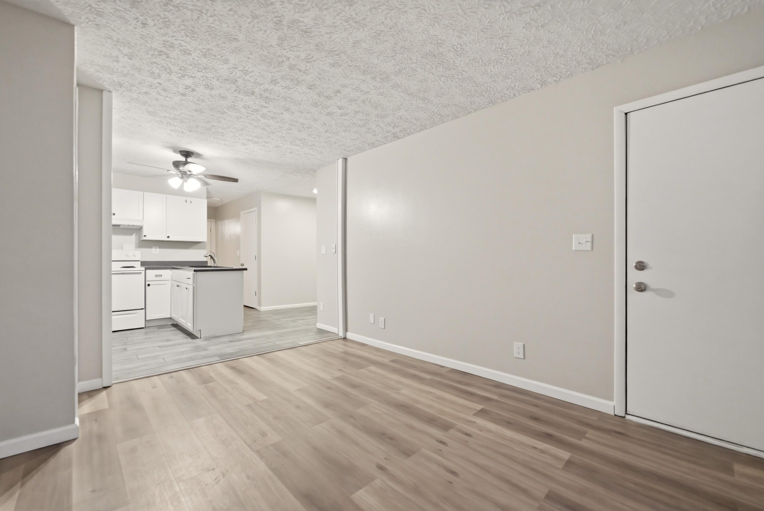 140 Sycamore Court, Unit 142 Hebron, IN 46341 - Photo 3 of 11 a view of a kitchen with wooden floor