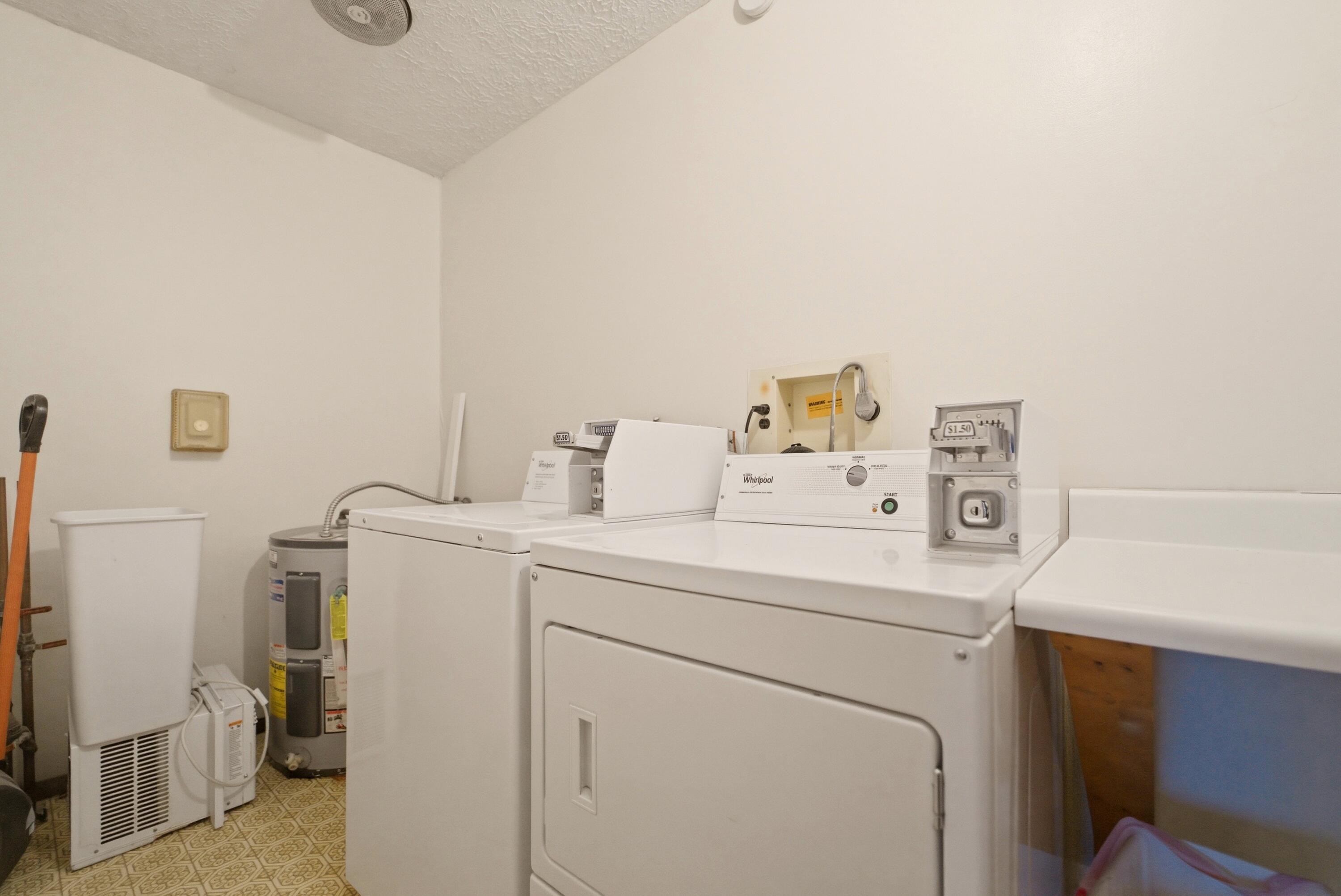 140 Sycamore Court, Unit 142 Hebron, IN 46341 - Photo 10 of 11 a utility room with dryer and washer