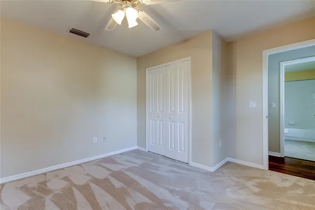 a view of a kitchen with a sink and a refrigerator