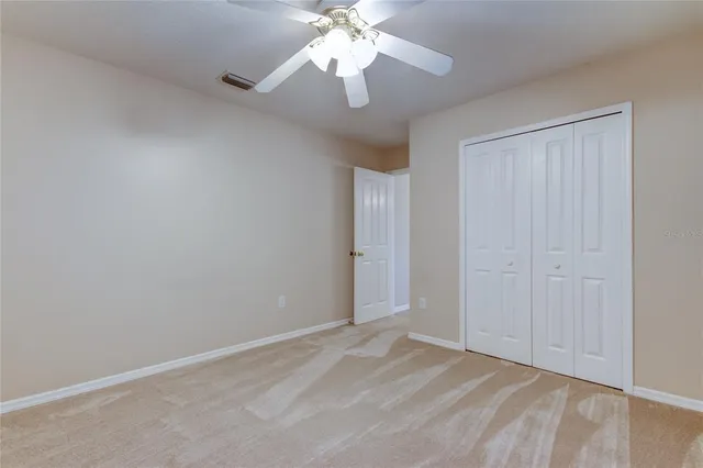 a bathroom with a granite countertop sink mirror and a bathtub
