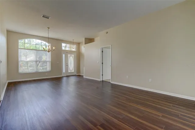 a view of a house with a yard and sitting area