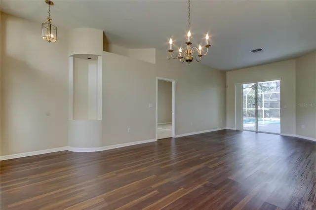 a bathroom with a granite countertop bathtub shower sink vanity and toilet