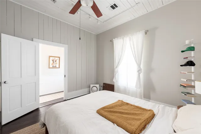 a bedroom with a bed and a cabinets