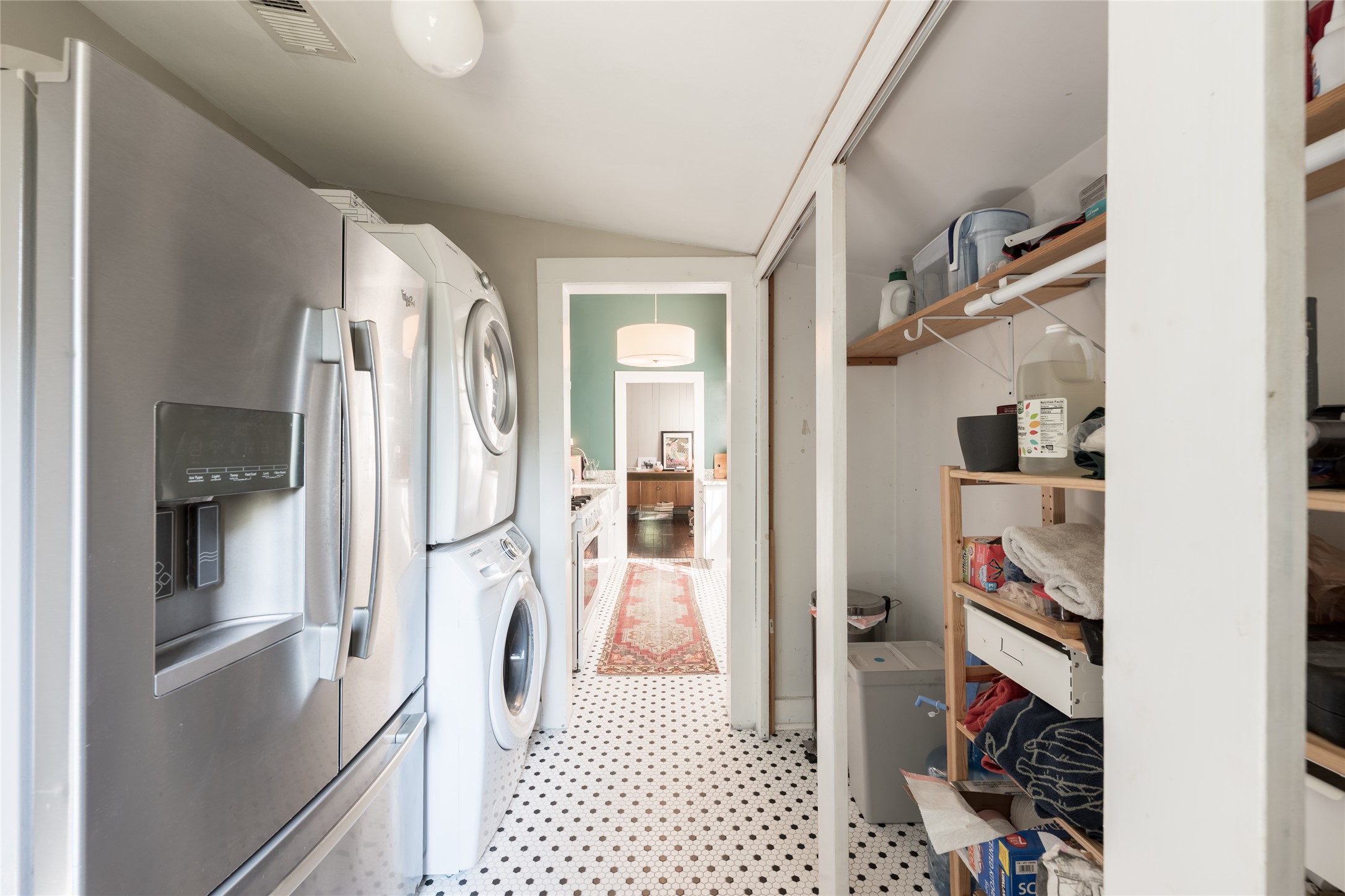 2011 Decatur Street Houston, TX 77007 - Photo 24 of 35 a view of walk in closet with clothes and shoes