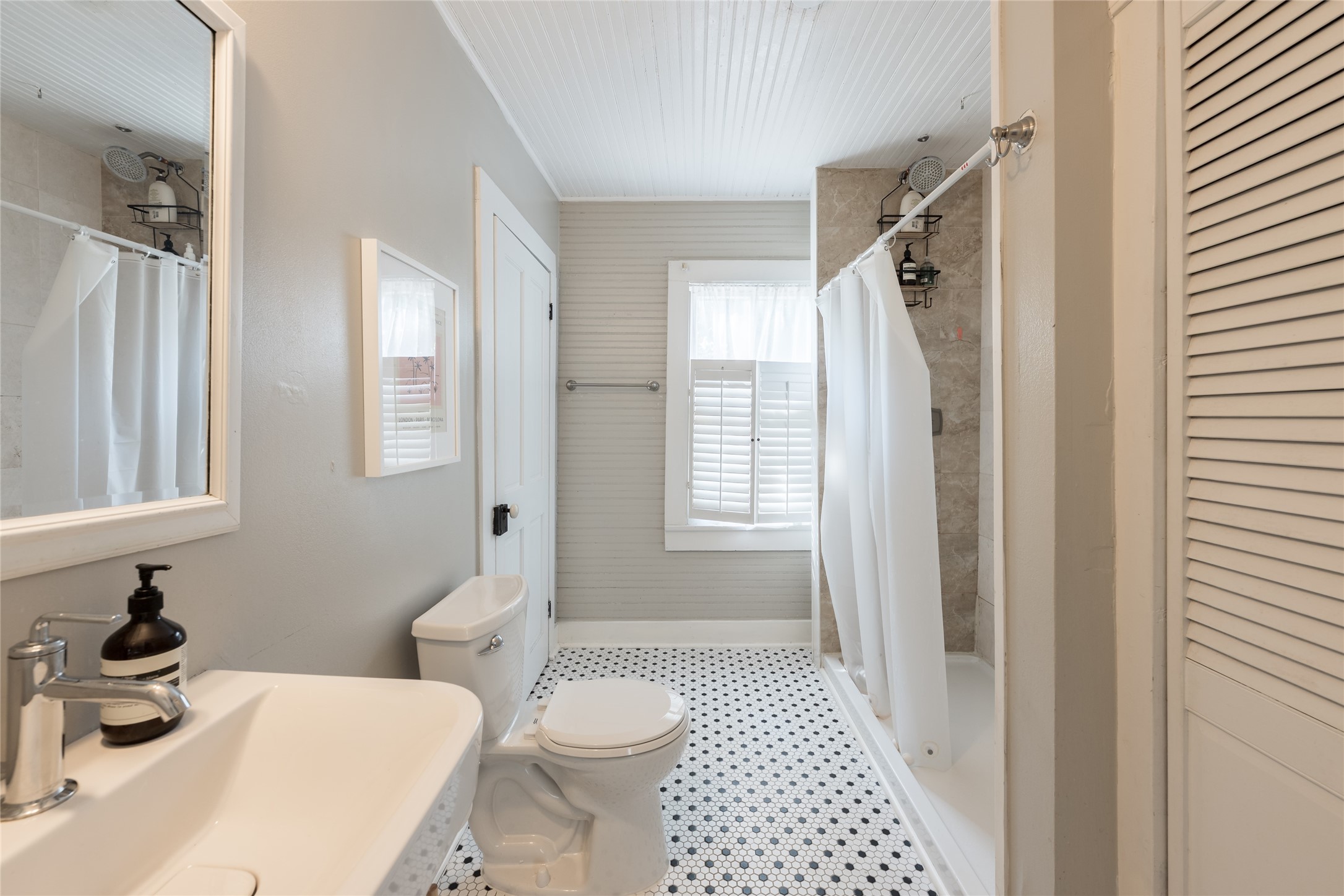 2011 Decatur Street Houston, TX 77007 - Photo 27 of 35 a bathroom with a sink a toilet and shower
