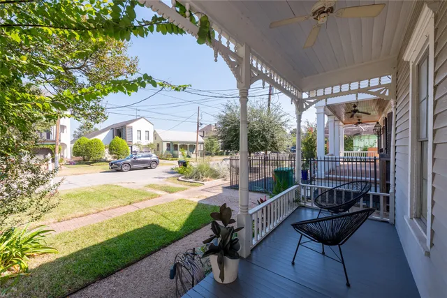 a view of a patio with couches chairs and a yard