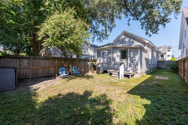 a view of a house with furniture and garden