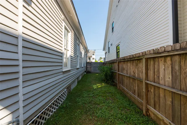 a view of a backyard with pathway