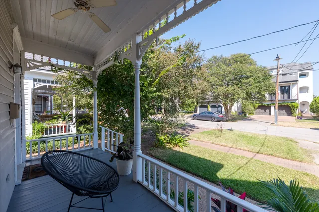 a view of a porch with furniture and wooden floor