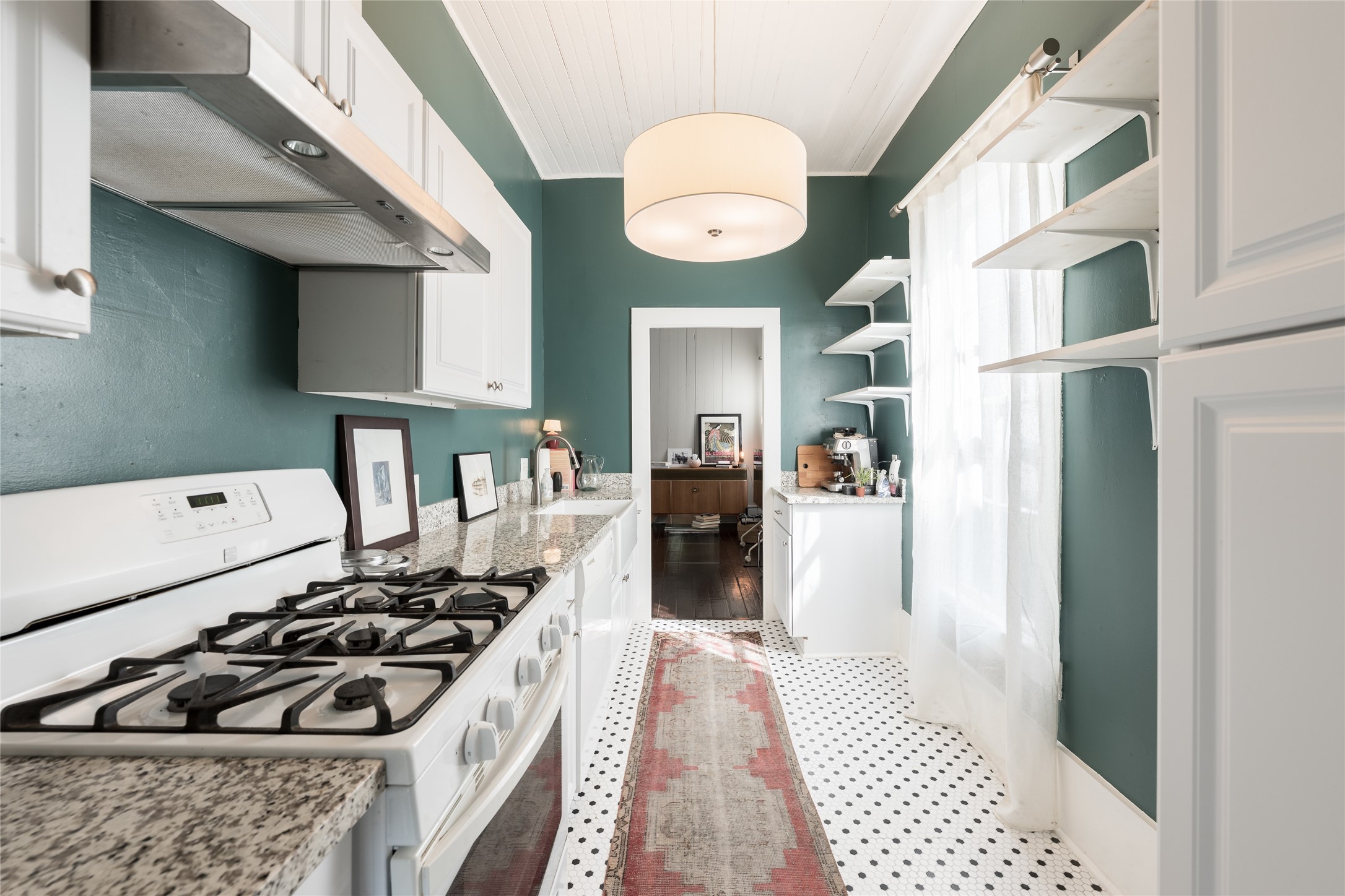 2011 Decatur Street Houston, TX 77007 - Photo 7 of 35 a kitchen with stainless steel appliances granite countertop a stove and a refrigerator