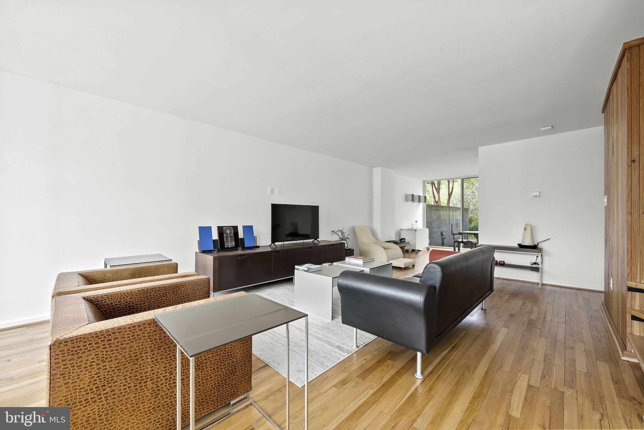 11585 Maple Ridge Road Reston, VA 20190 - Photo 13 of 48 a living room with furniture and a wooden floor