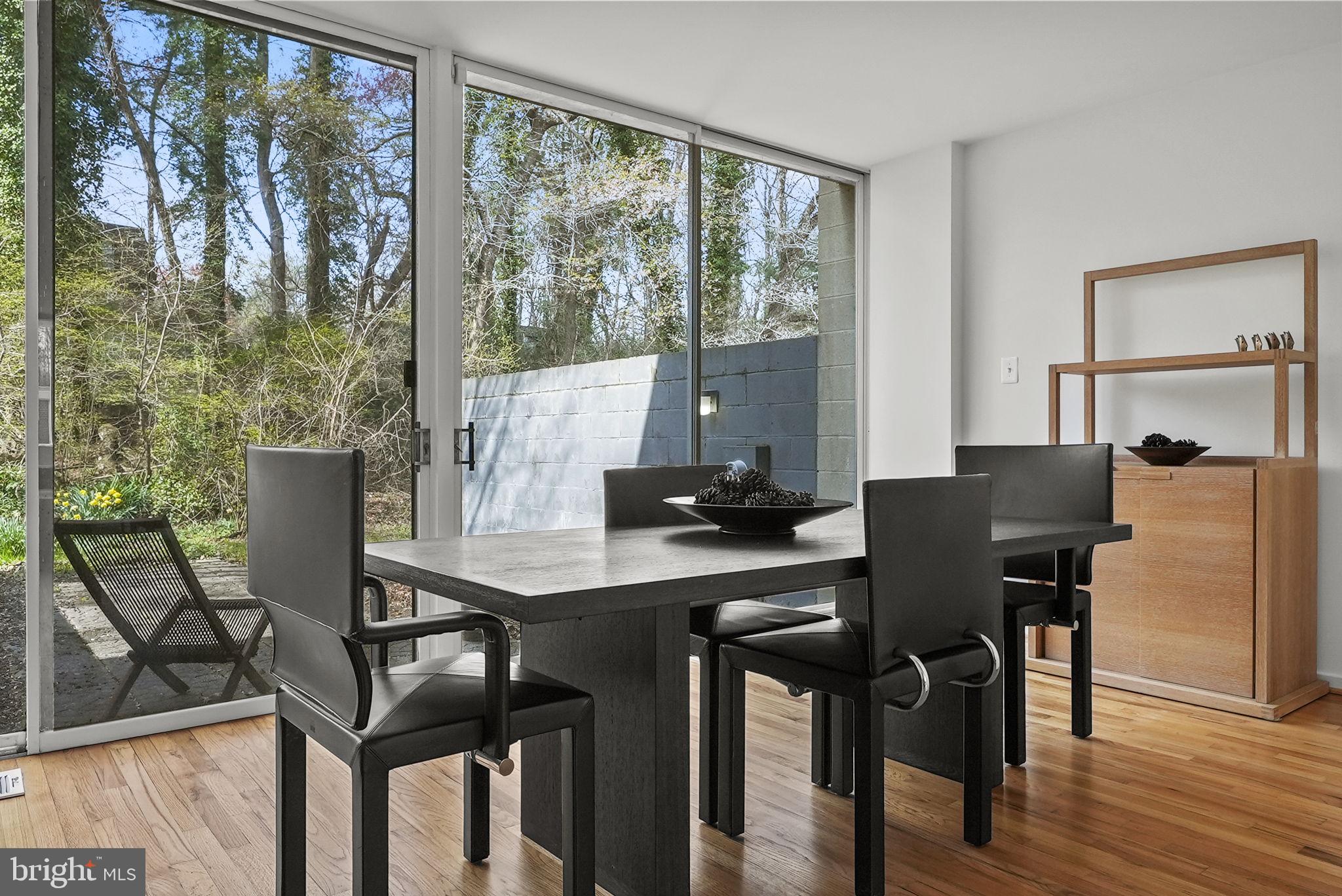 11585 Maple Ridge Road Reston, VA 20190 - Photo 19 of 48 a view of a dining room with furniture and wooden floor