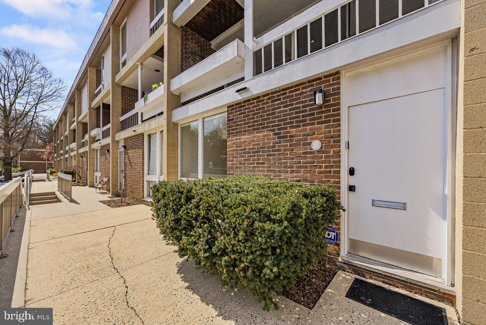 11585 Maple Ridge Road Reston, VA 20190 - Photo 2 of 48 a view of a building with a yard