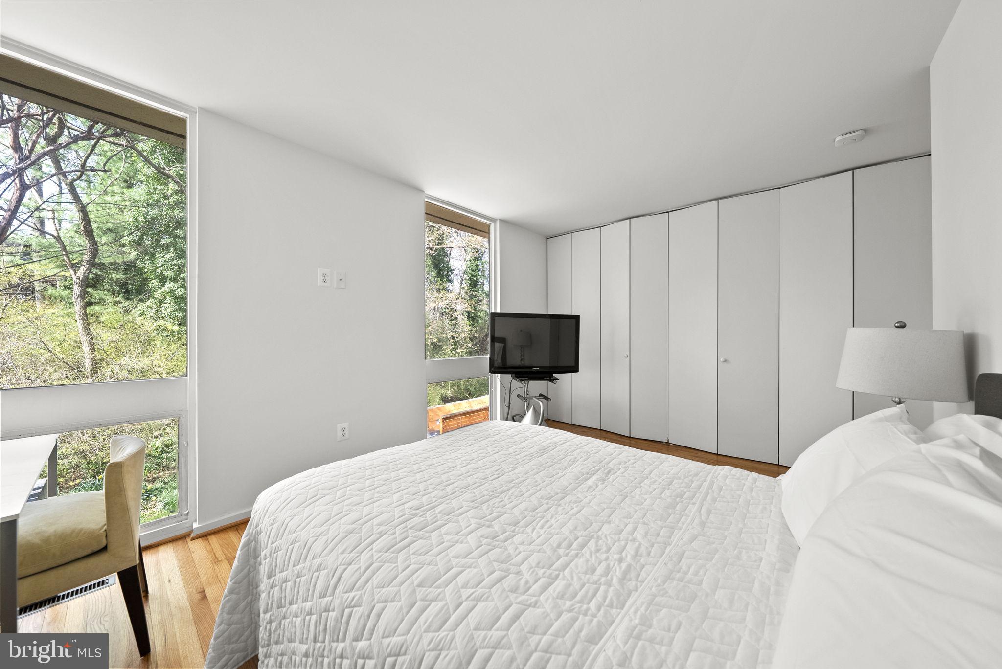 11585 Maple Ridge Road Reston, VA 20190 - Photo 24 of 48 a bedroom with a bed and a window