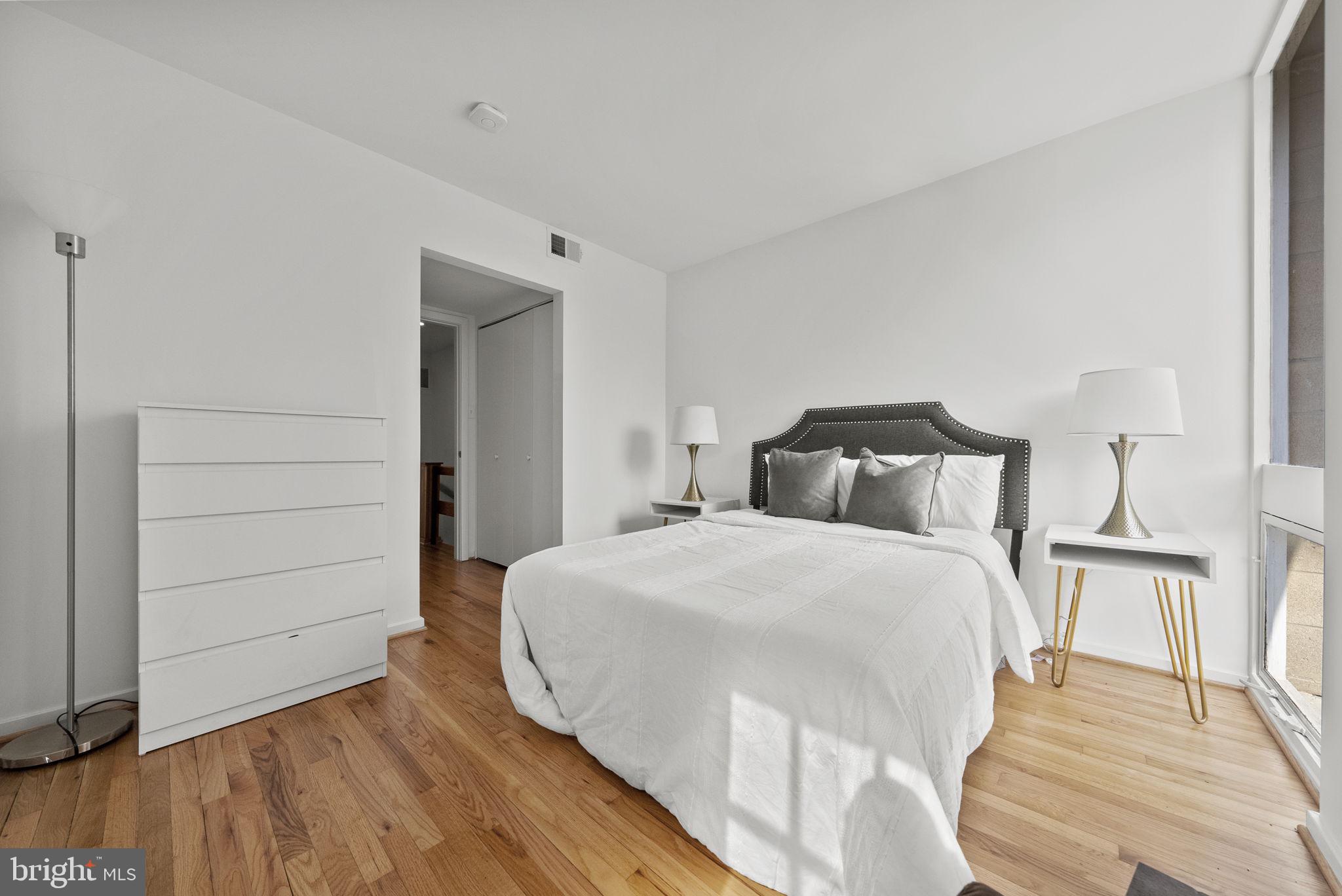 11585 Maple Ridge Road Reston, VA 20190 - Photo 31 of 48 a bedroom with a bed and a mirror