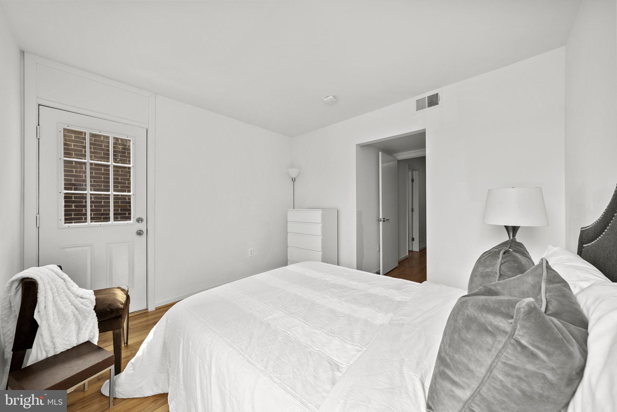 11585 Maple Ridge Road Reston, VA 20190 - Photo 32 of 48 a bedroom with bed and a window