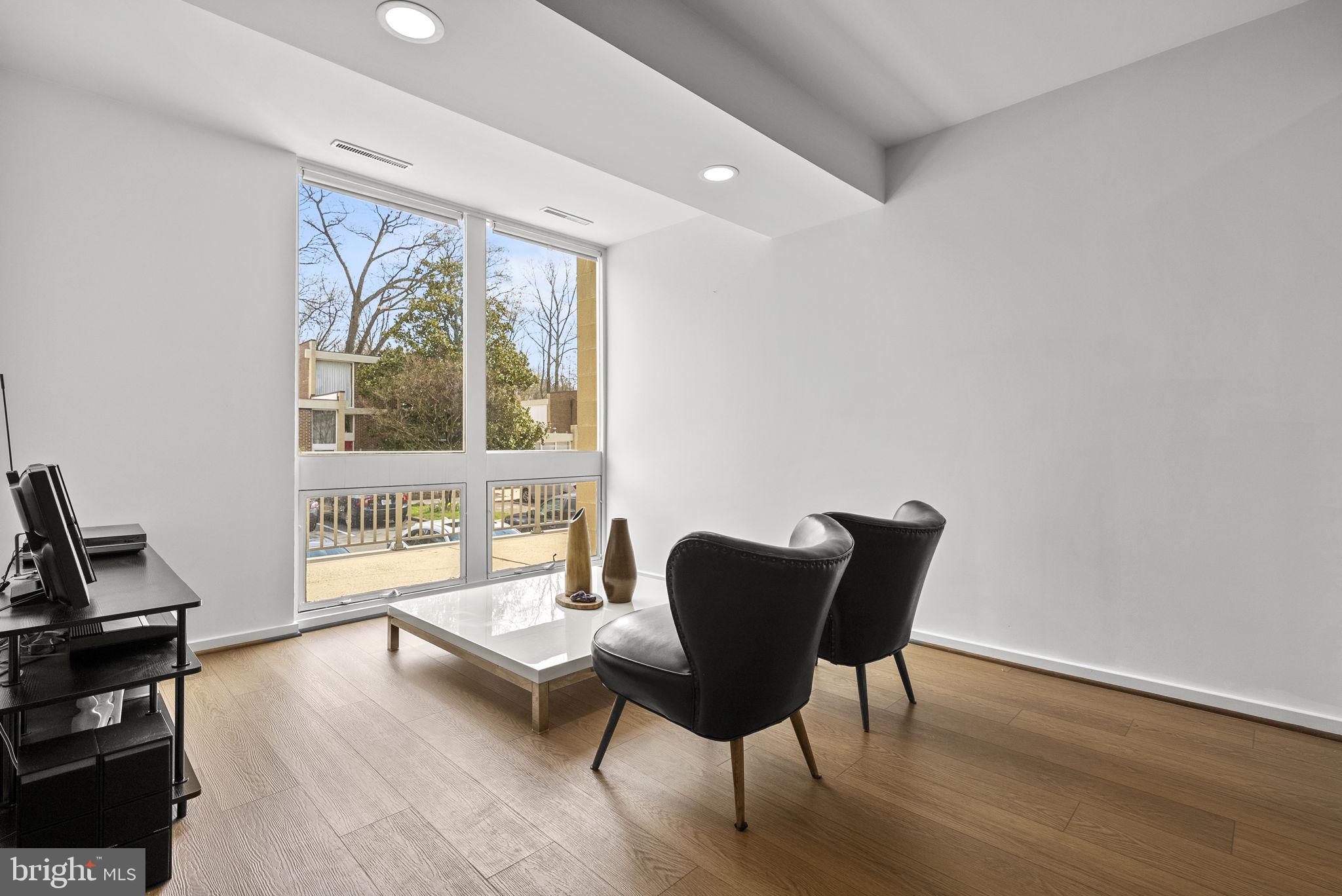 11585 Maple Ridge Road Reston, VA 20190 - Photo 4 of 48 a living room with furniture and a window