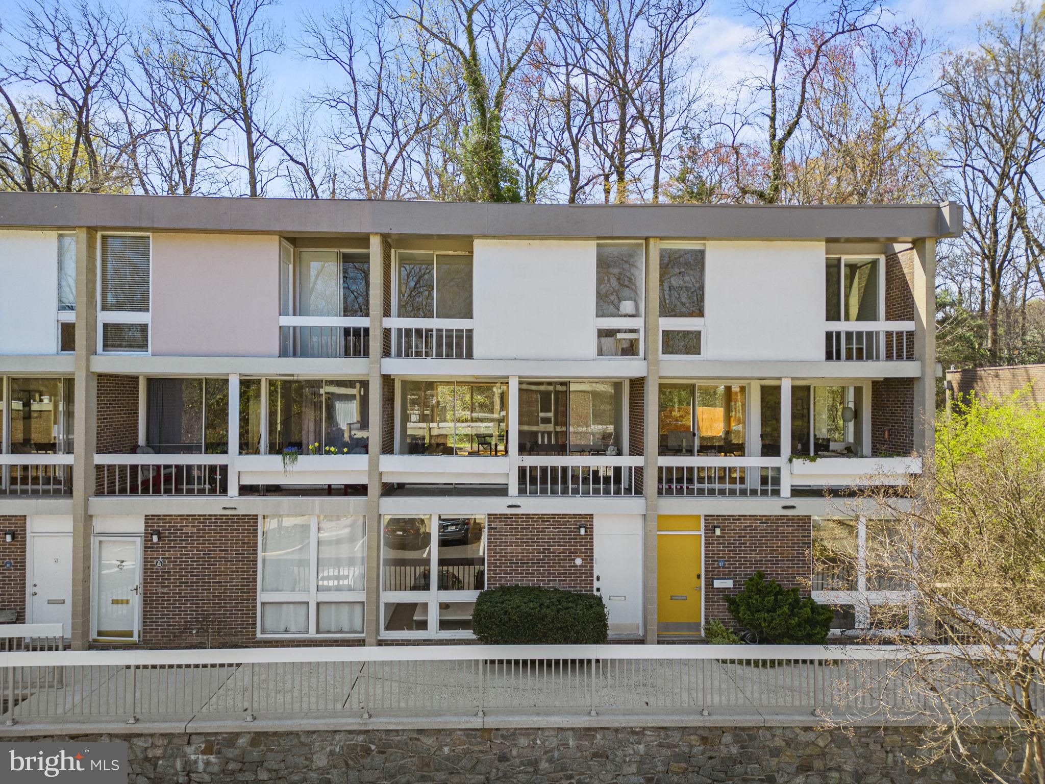 11585 Maple Ridge Road Reston, VA 20190 - Photo 42 of 48 front view of a building with a garden