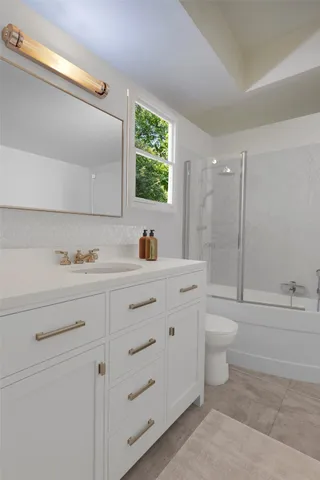 a bathroom with a glass shower door