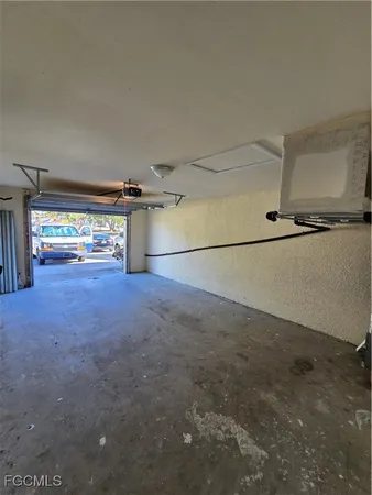 a view of an empty room and a window