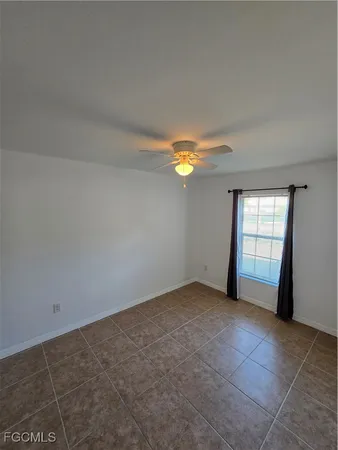 an empty room with windows and entrance