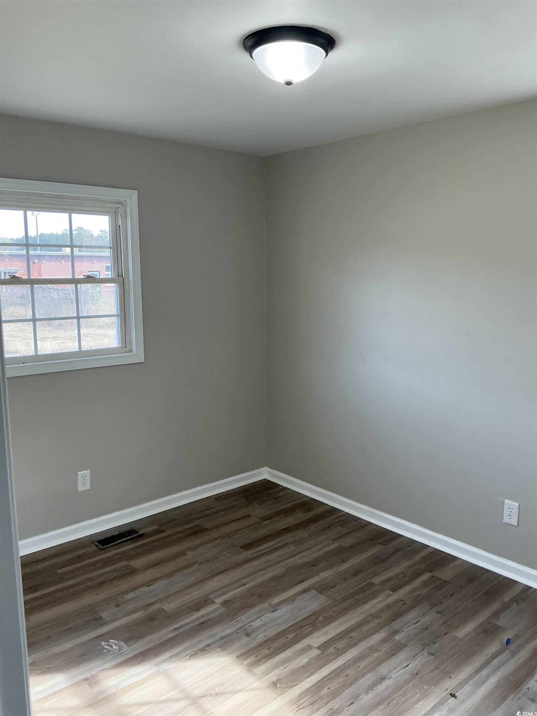 105 Mace Court Latta, SC 29565 - Photo 12 of 12 Unfurnished room with wood finished floors and baseboards