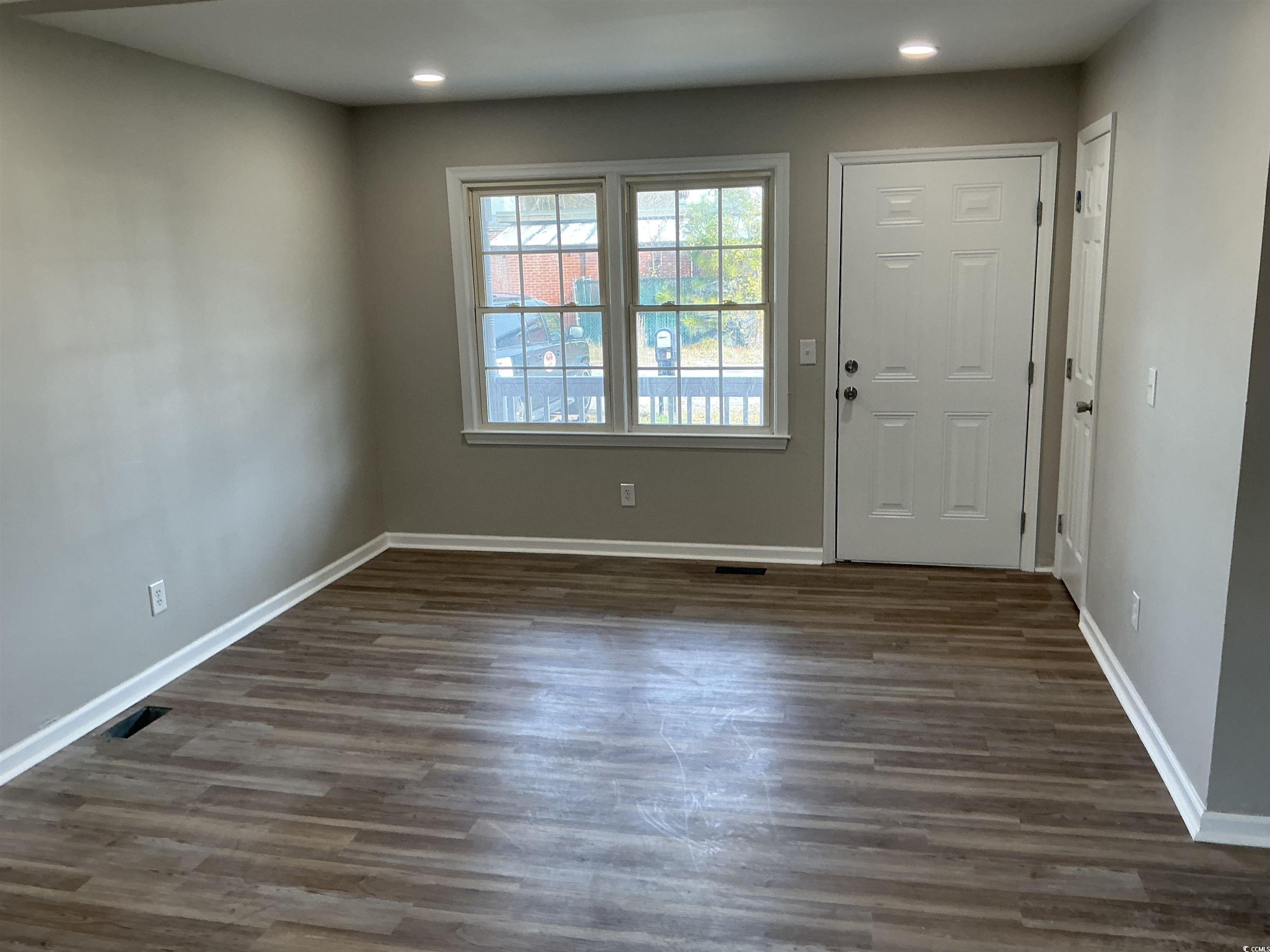 105 Mace Court Latta, SC 29565 - Photo 7 of 12 Foyer with dark wood-style floors and recessed lighting