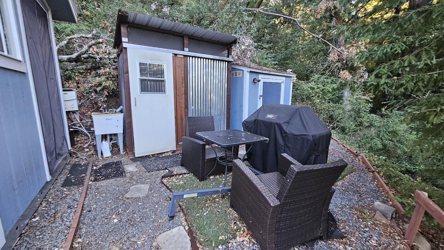 20245 Gist Road Los Gatos, CA 95033 - Photo 9 of 13 a view of a house with backyard and sitting area