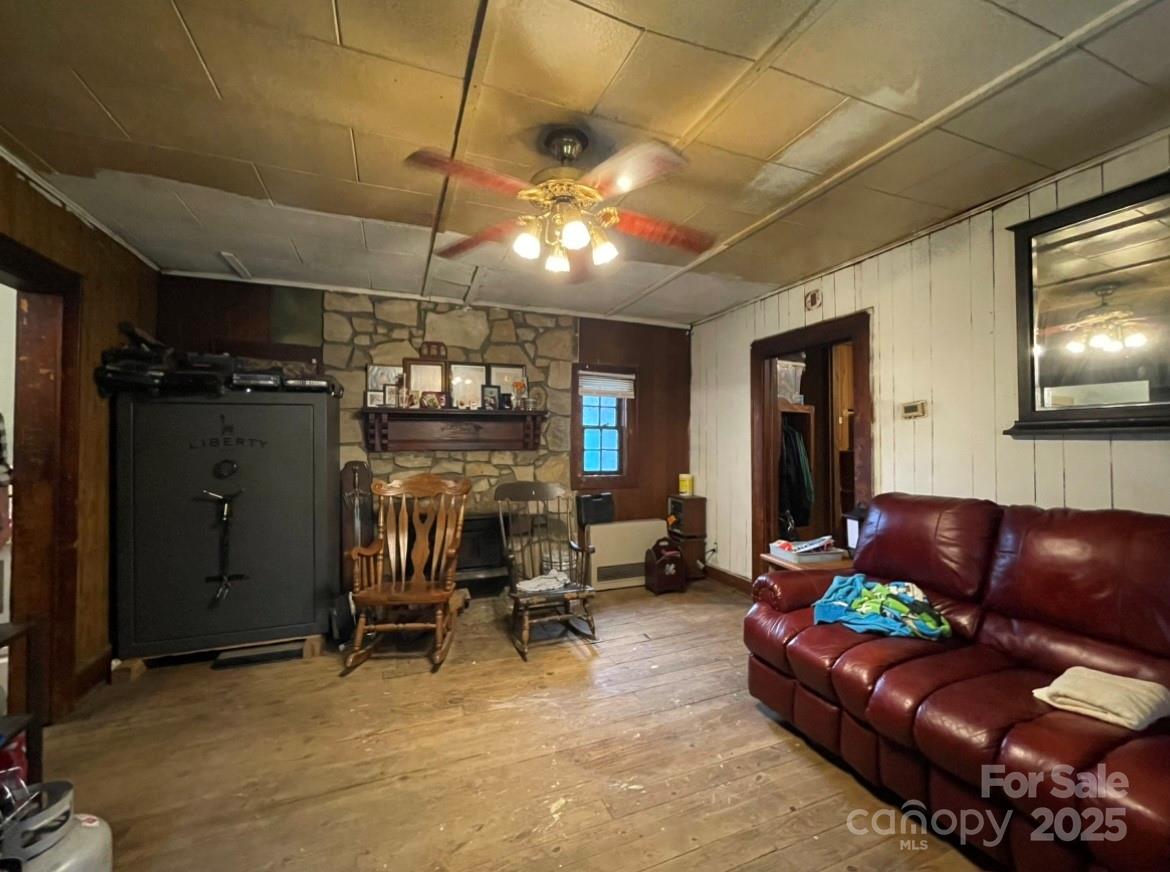 130 Lookout Road Asheville, NC 28804 - Photo 14 of 18 a living room with furniture a dining table and a fireplace