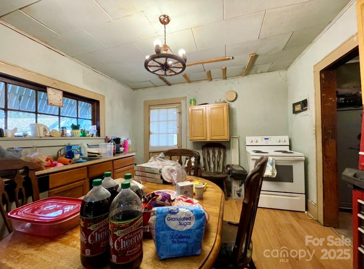 130 Lookout Road Asheville, NC 28804 - Photo 17 of 18 a living room with furniture and a chandelier