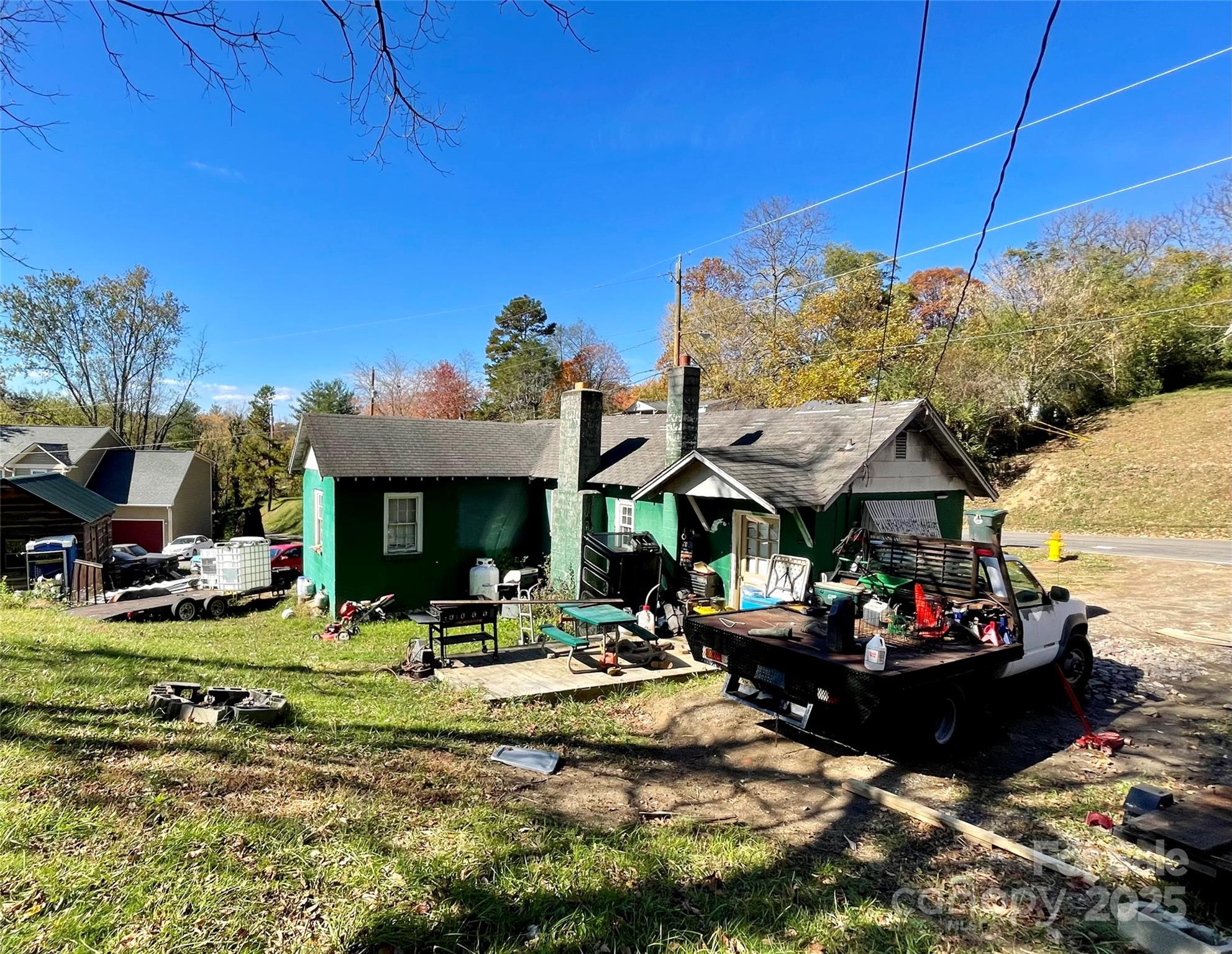 130 Lookout Road Asheville, NC 28804 - Photo 7 of 18 a front view of a house with swimming pool and a yard