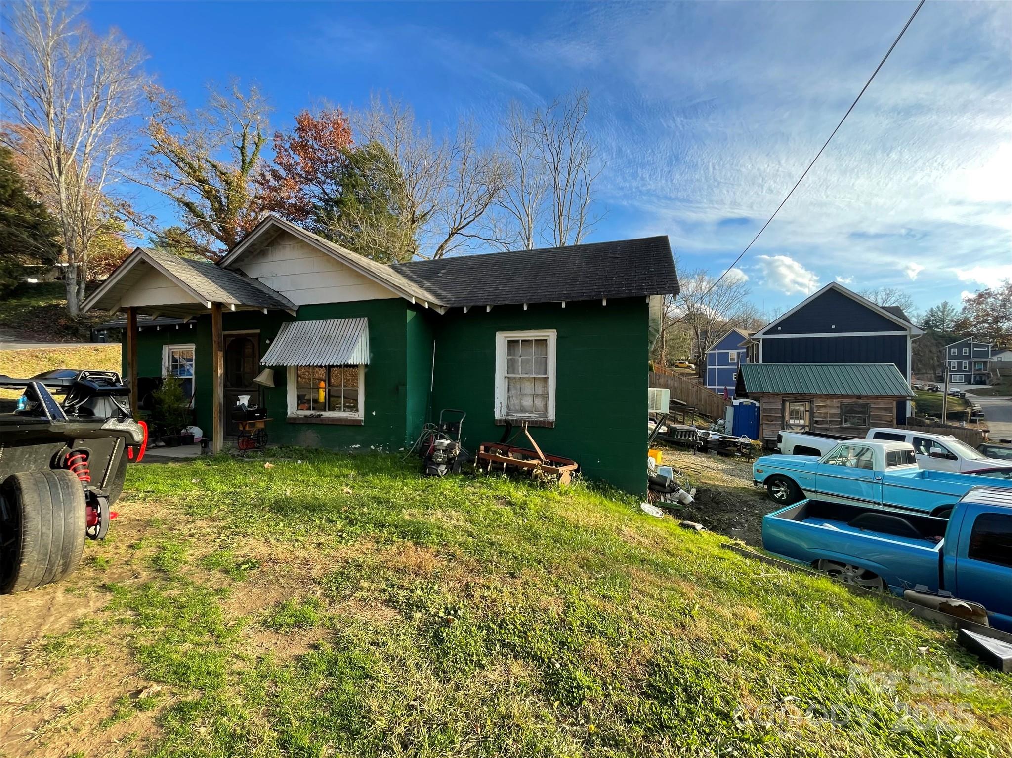 130 Lookout Road Asheville, NC 28804 - Photo 9 of 18 a view of a house with backyard porch and sitting area