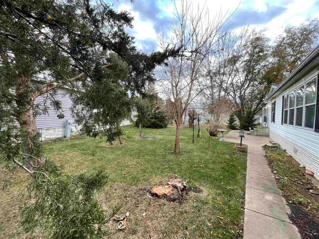 a backyard of a house with lots of green space