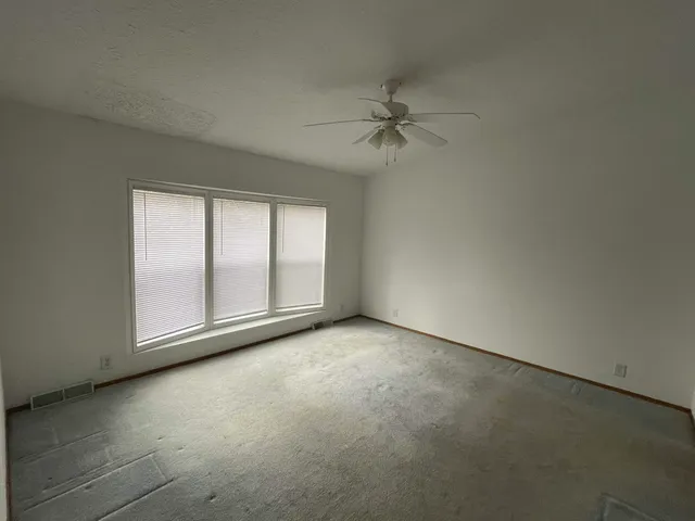 an empty room with windows