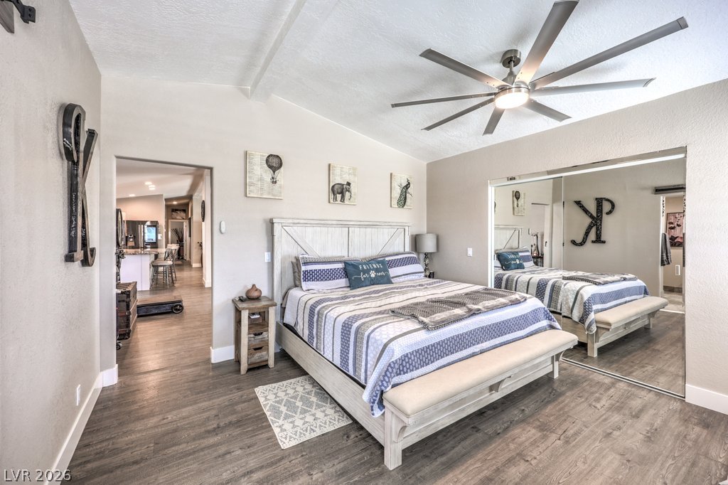 4375 Pinwheel Street Logandale, NV 89021 - Photo 20 of 52 Primary bedroom features durable hardwood flooring and a functional ceiling fan for optimal comfort.