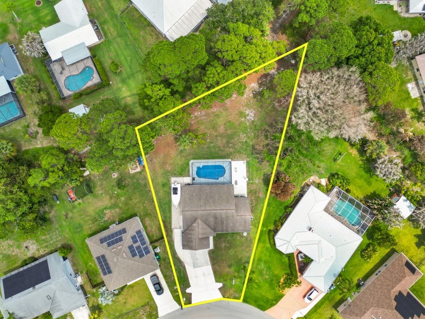 1950 Southwest Logwood Road Port St. Lucie, FL 34953 - Photo 32 of 32 an aerial view of a house with a yard and balcony