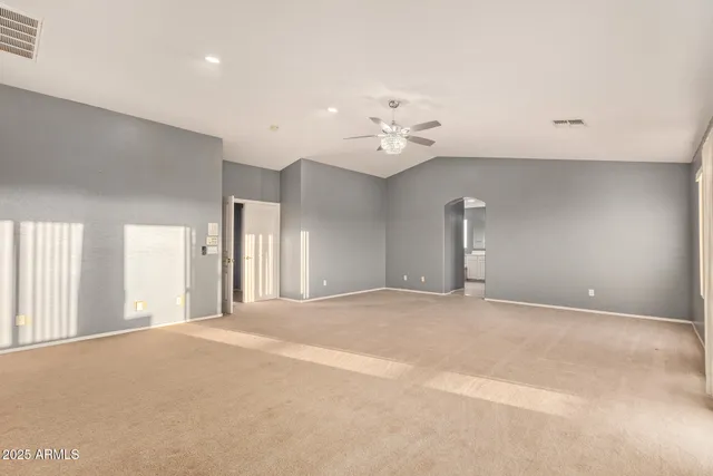 a spacious bathroom with a tub a sink and a mirror