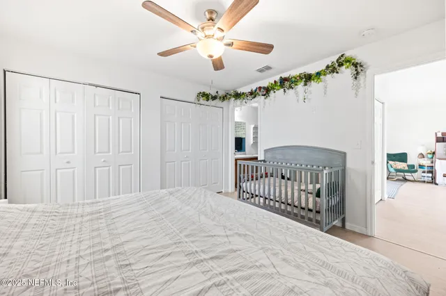a bathroom with a sink a toilet a mirror and shower curtain