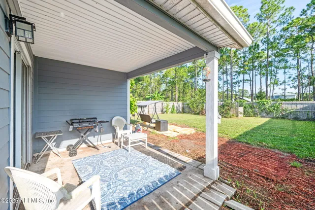 a view of a patio with a backyard