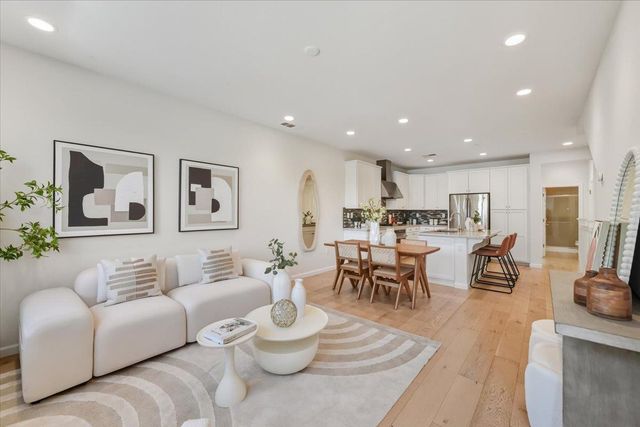 front view of a house with a lot of flowers