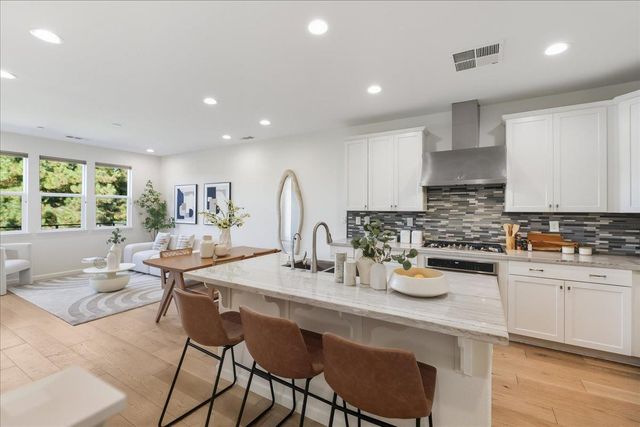 a view of empty room with furniture and refrigerator