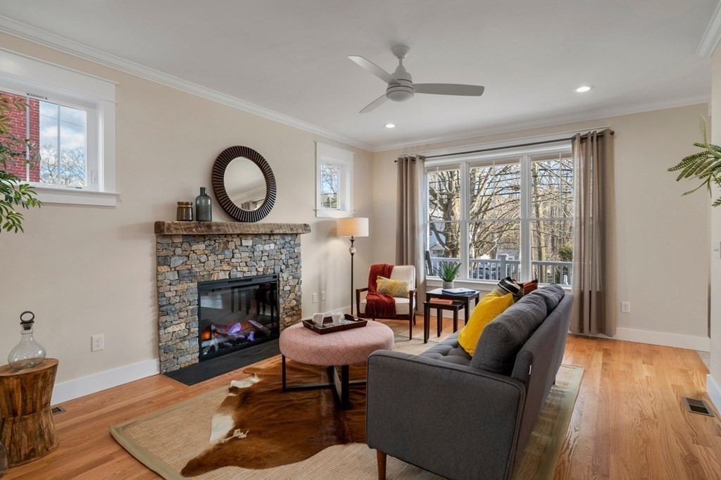 a living room with furniture and a fireplace