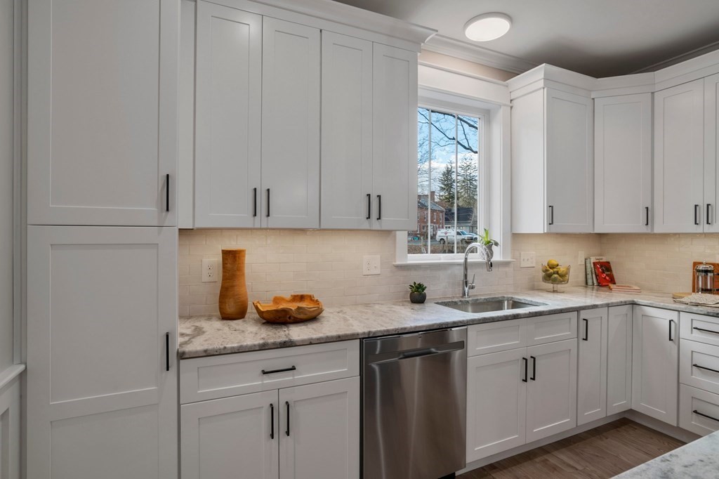 297 Riverside Drive Northampton, MA 01062 - Photo 12 of 32 a kitchen with a sink cabinets and window