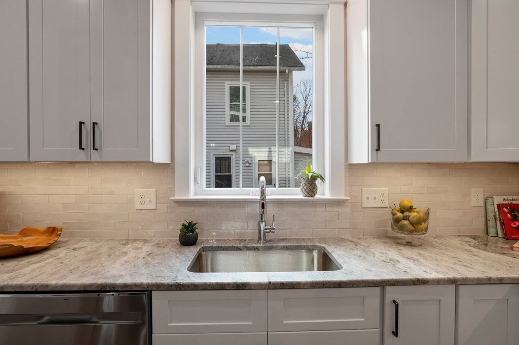 297 Riverside Drive Northampton, MA 01062 - Photo 13 of 32 a kitchen with granite countertop white cabinets and a sink