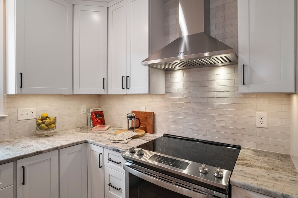 297 Riverside Drive Northampton, MA 01062 - Photo 15 of 32 a stove top oven sitting inside of a kitchen